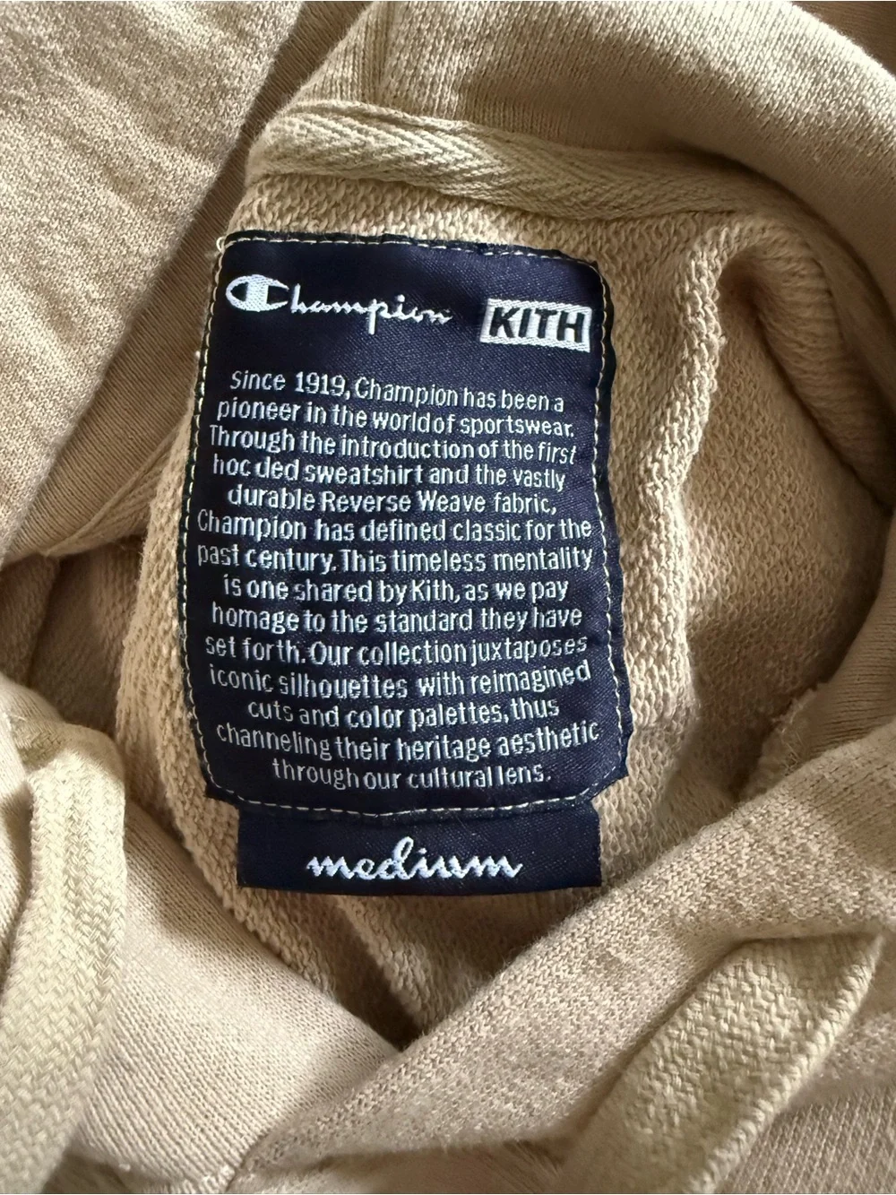 Kith and Champion Collab Beige Hoodie with Multicolor Sleeve Logo